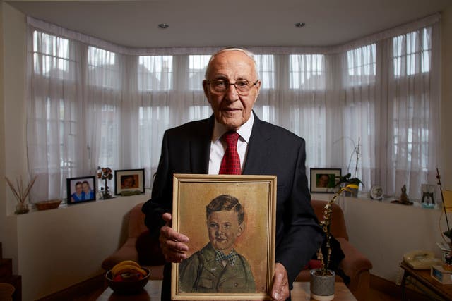Manfred Goldberg holding a painting of his lost brother in ‘The Last Survivors’