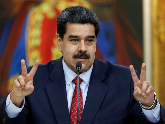 Venezuela's President Nicolas Maduro gestures as he speaks during a news conference at Miraflores Palace in Caracas