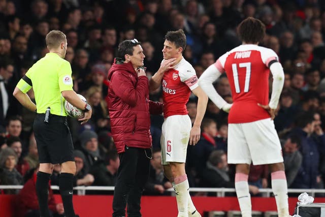 Laurent Koscielny picked up the issue in a second-half collision with Romelu Lukaku