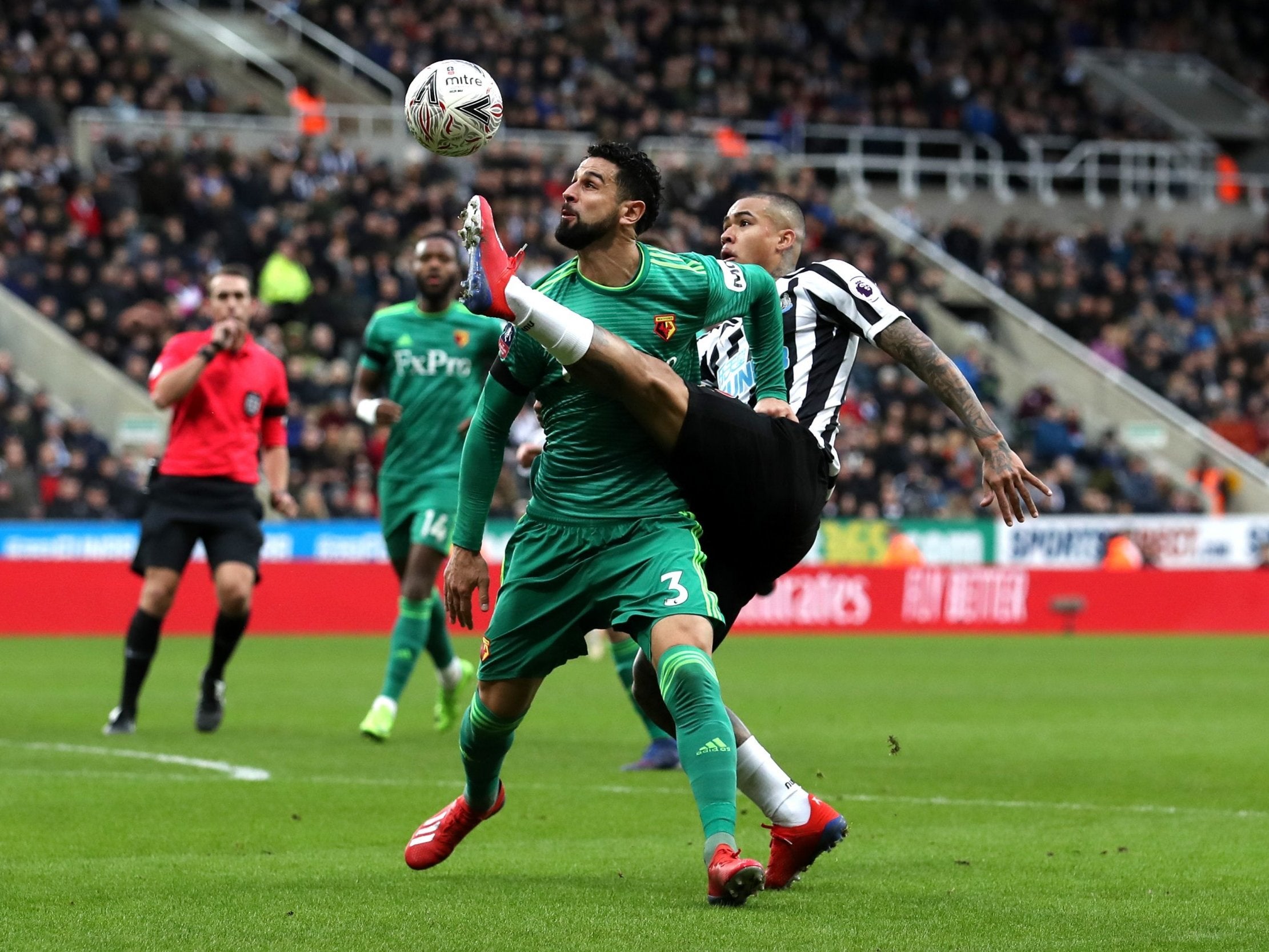 Miguel Britos is challenged by Newcastle's Kenedy