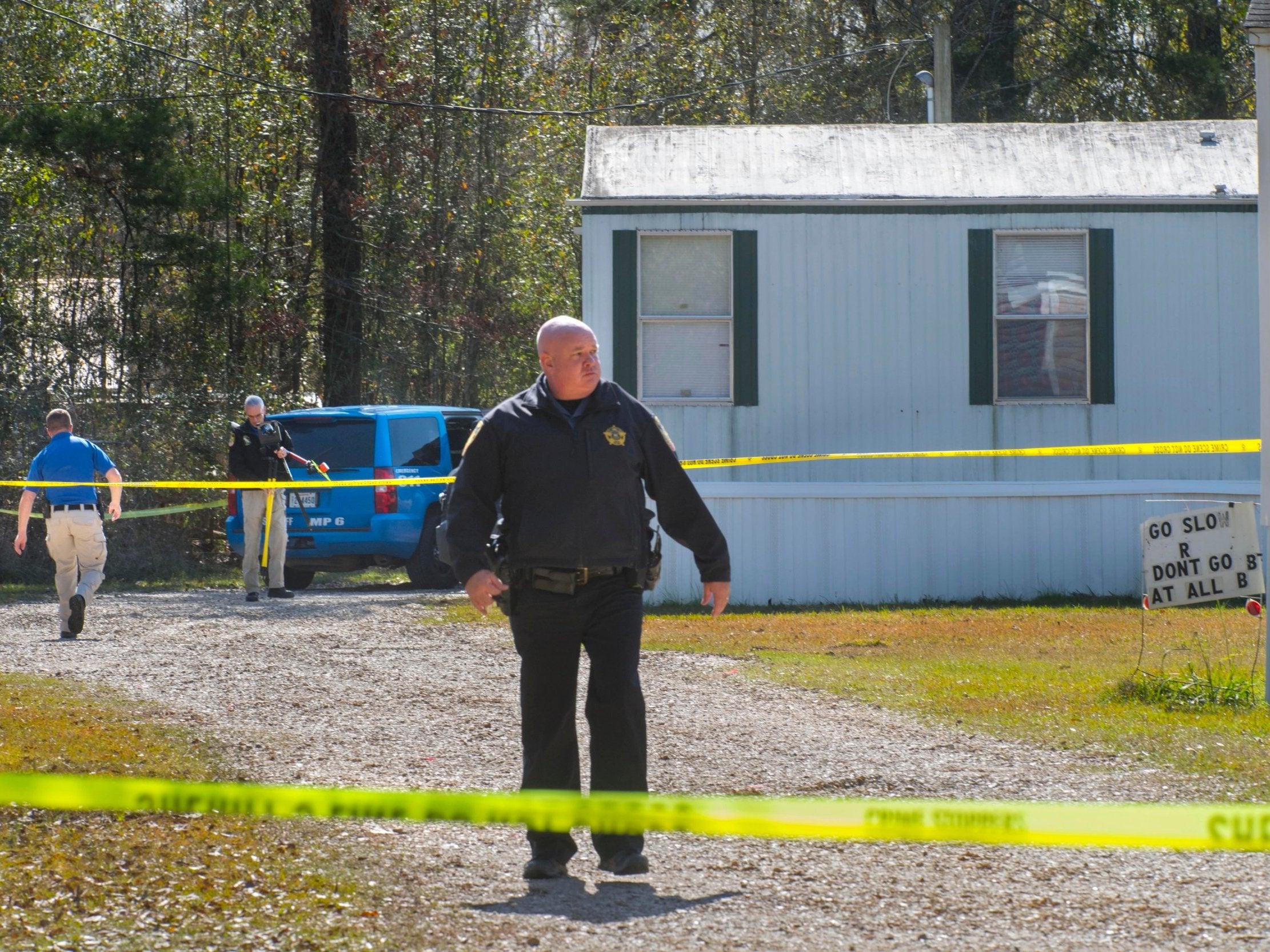Investigators at the scene of the shooting in Livingston Parish