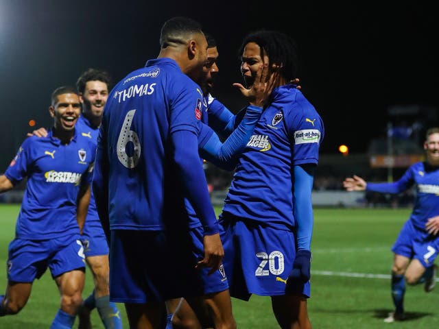 Wimbledon celebrate Toby Sibbick's late goal to seal the win