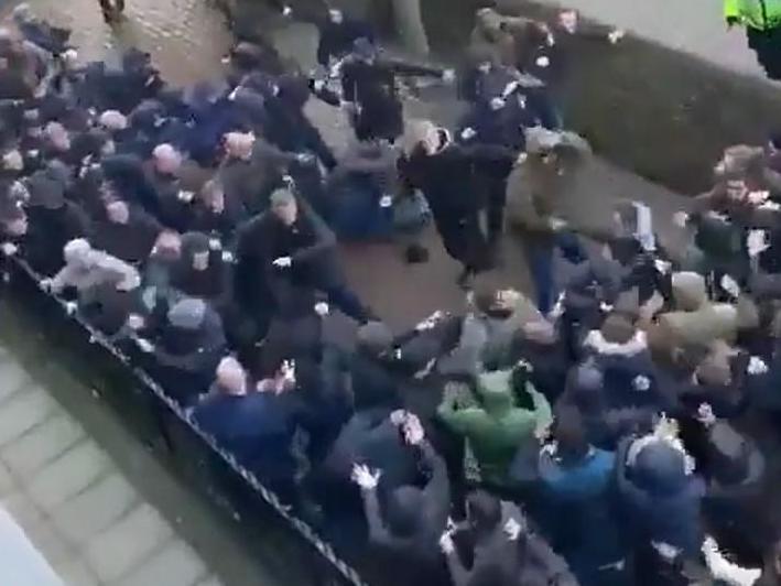 Millwall and Everton fans fight before their teams play in the FA Cup