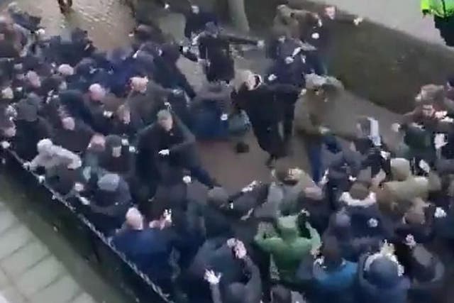 Millwall and Everton fans fight before their teams play in the FA Cup