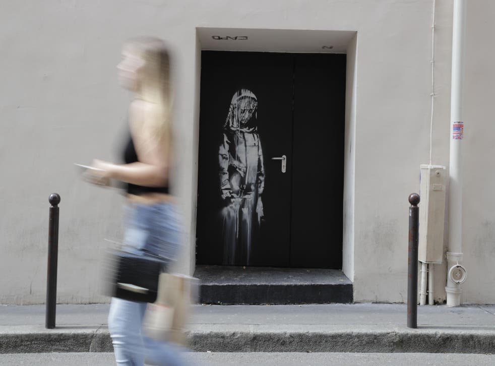 The Banksy mural on the door of the Bataclan in Paris