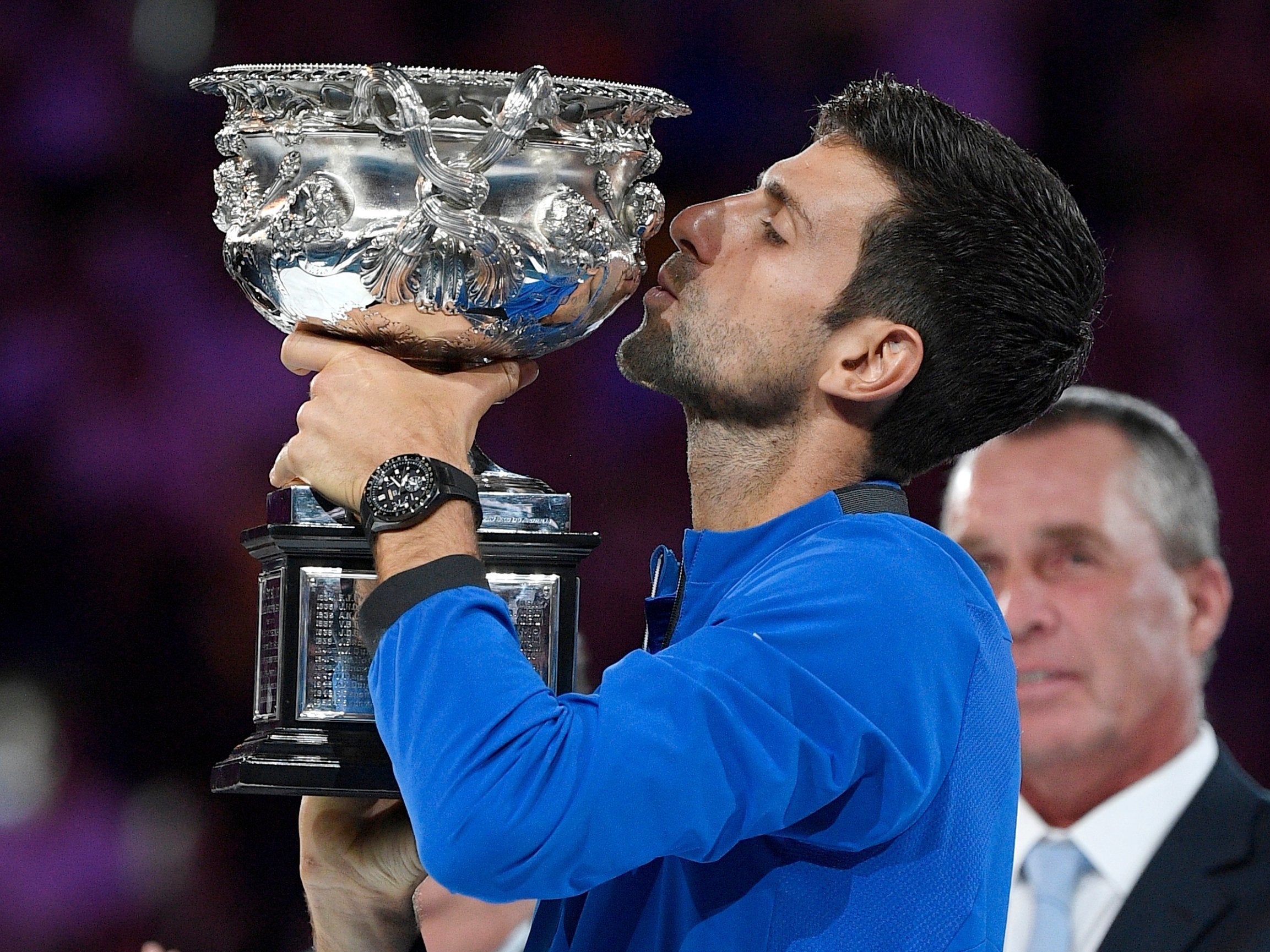 Djokovic kisses the trophy for a record seventh time