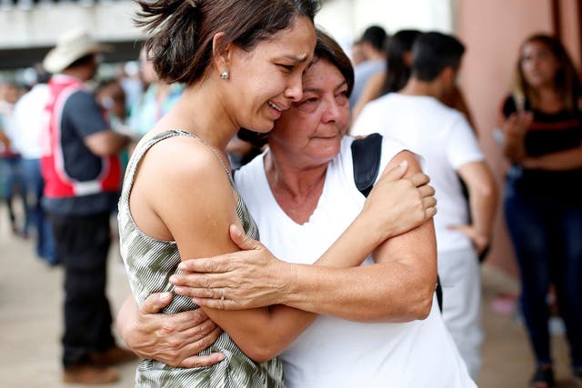 Relatives of missing people waiting for news after dam disaster
