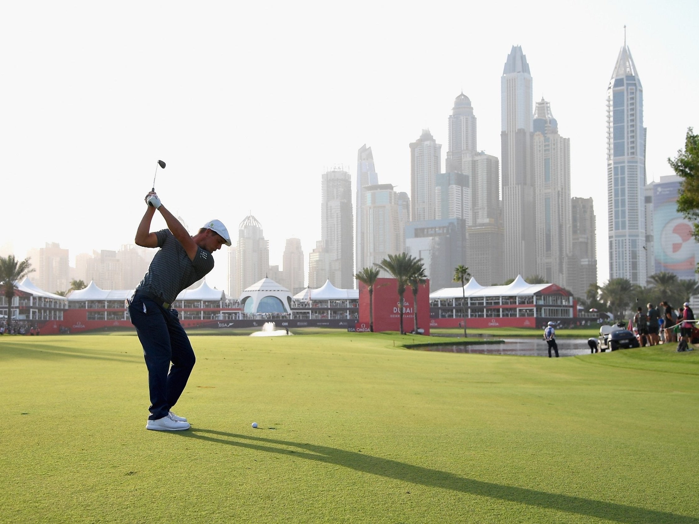 Bryson Dechambeau takes aim on the 18th at the Emirates Golf Club in Dubai (Getty )