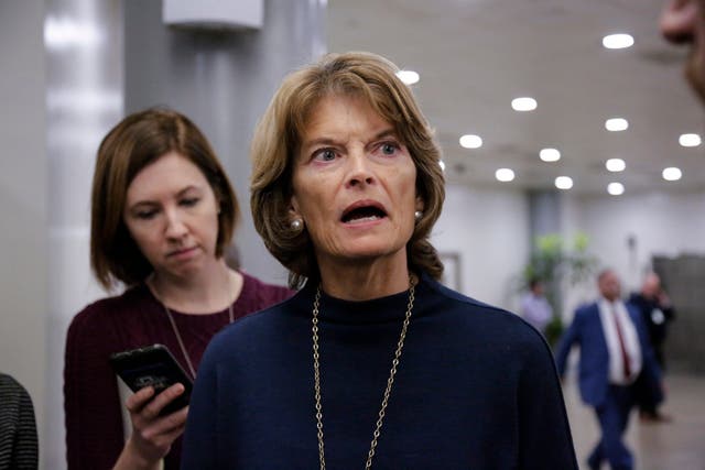 Senator Lisa Murkowski answers questions from reporters after she called yesterday for President Donald Trump to end the partial government shutdown
