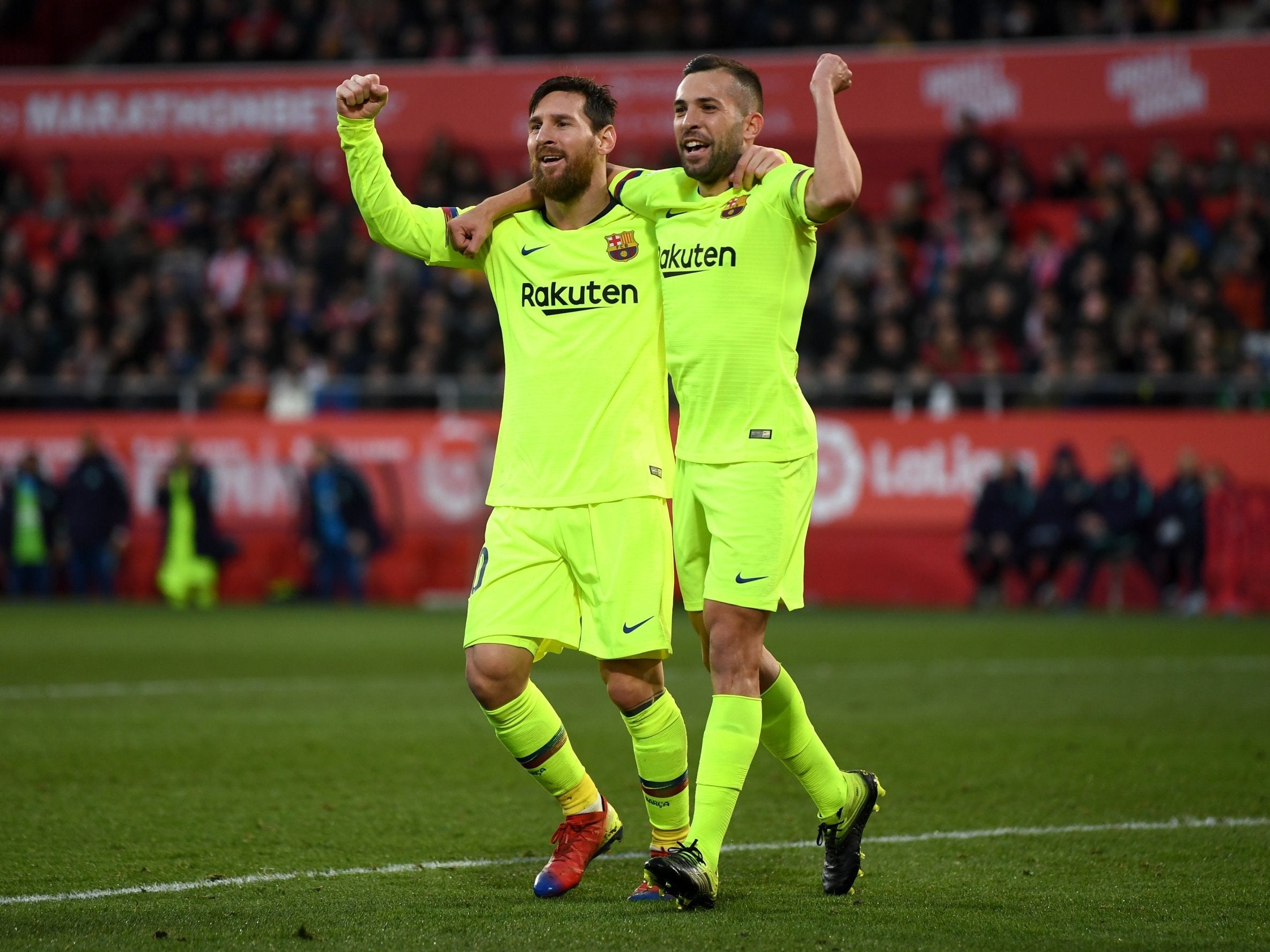 Lionel Messi celebrates his goal with Jordi Alba