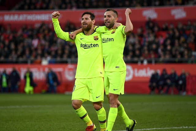 Lionel Messi celebrates his goal with Jordi Alba