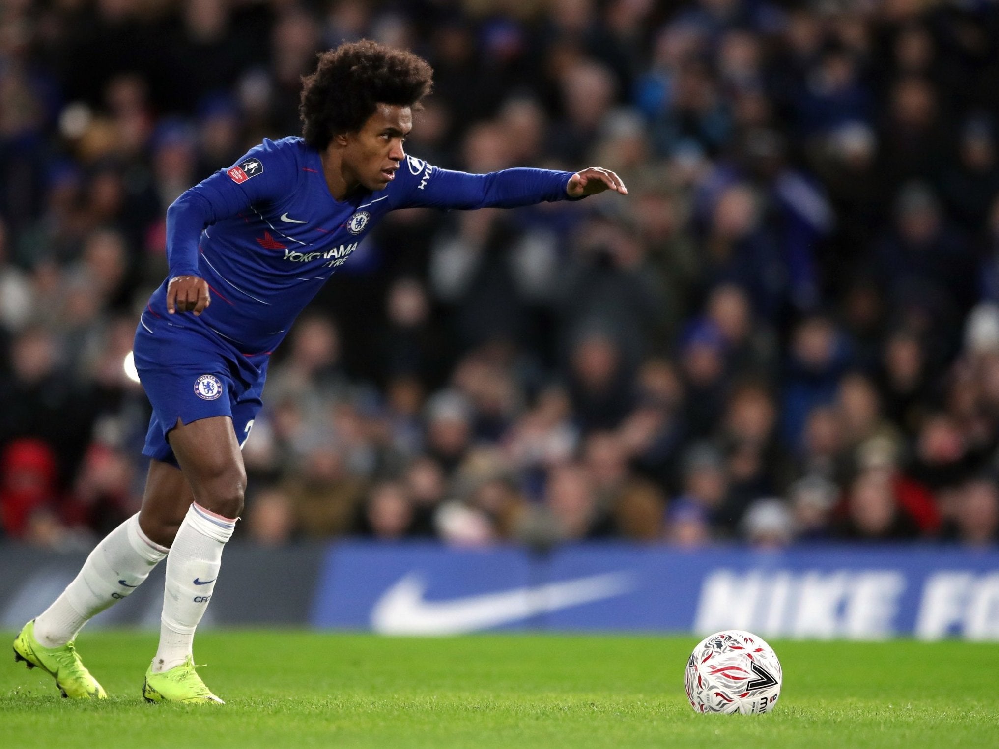 Willian runs up to score from the penalty spot