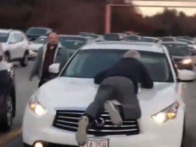 A 65-year-old held on to the car for three miles