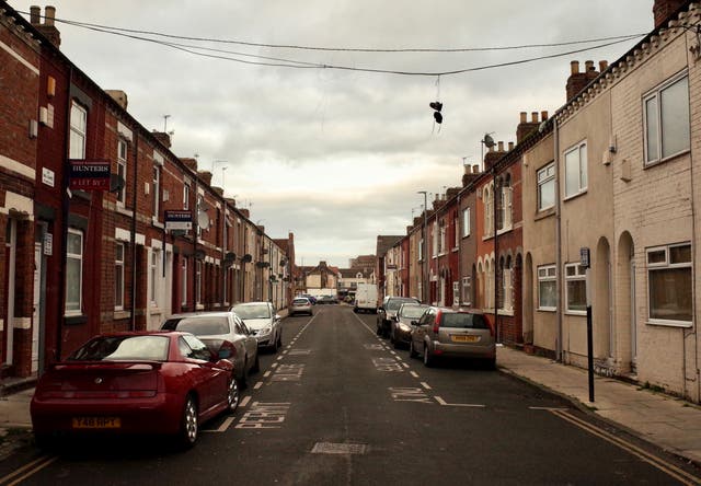 Middlesbrough: shoes hang from lines of communication, sagging between houses