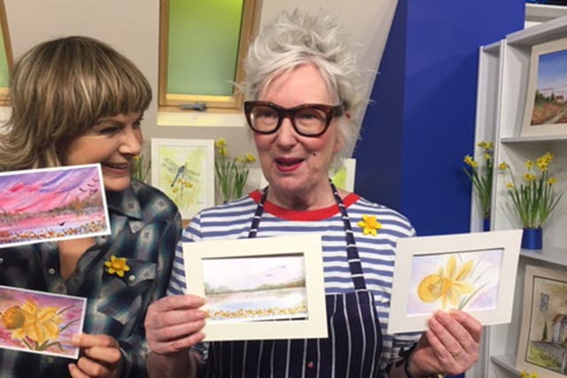 Jenny Eclair and Penny Smith show off the watercolours they painted to raise money for Marie Curie