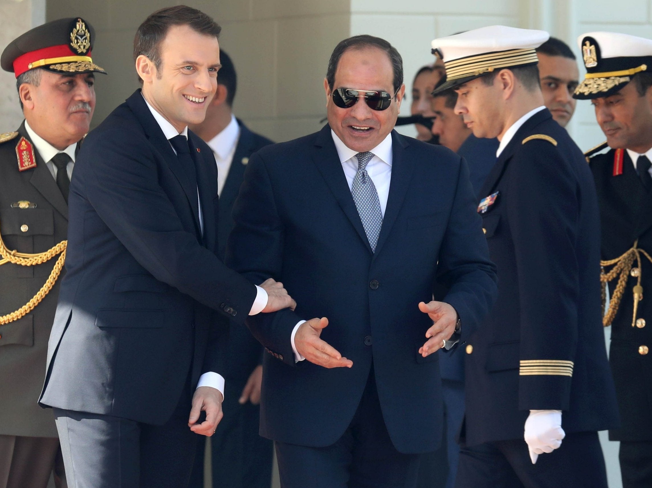 French President Emmanuel Macron (L) and Egyptian counterpart Abdel Fattah al-Sissi are pictured during a welcome ceremony at the presidential palace in Cairo on 28 January, 2019.