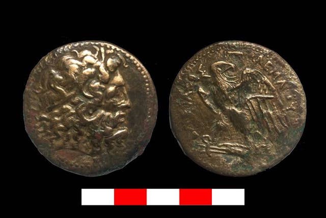 Ptolemaic era coins discovered in an ancient wine cellar north of Cairo