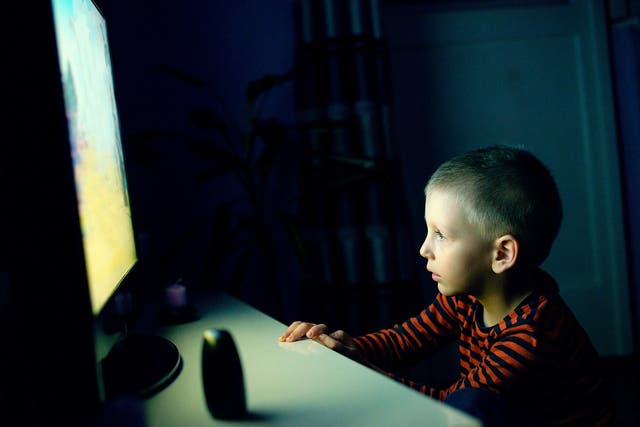 Child watches cartoon on TV