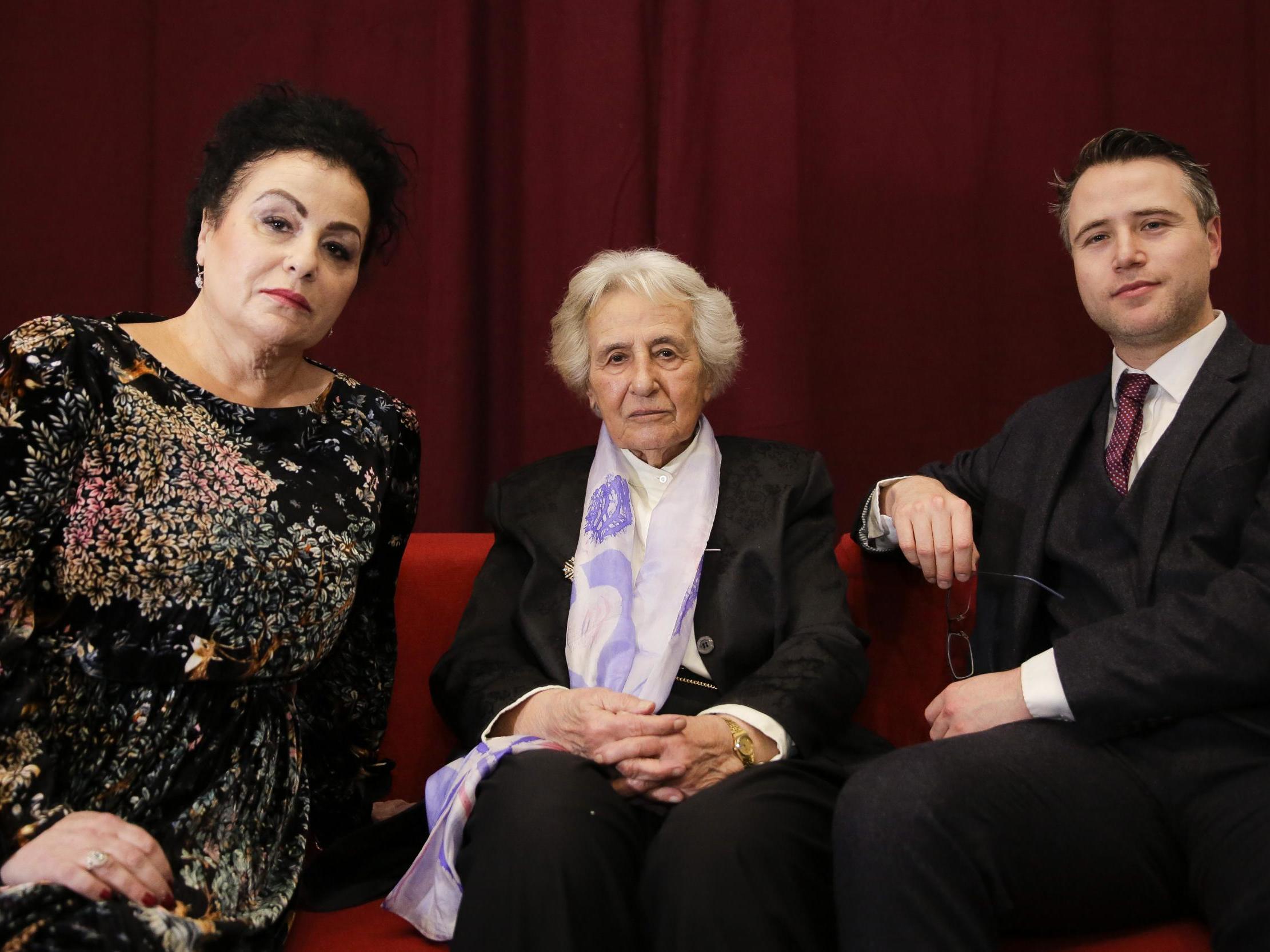 Holocaust survivor Anita Lasker-Wallfisch, centre, her daughter Maya Jacobs Lasker-Wallfisch, left, and her grandson Simon Wallfisch, right, pose for a photo after an interview with the Associated Press in Berlin, Germany, Sunday 27 January 2019.