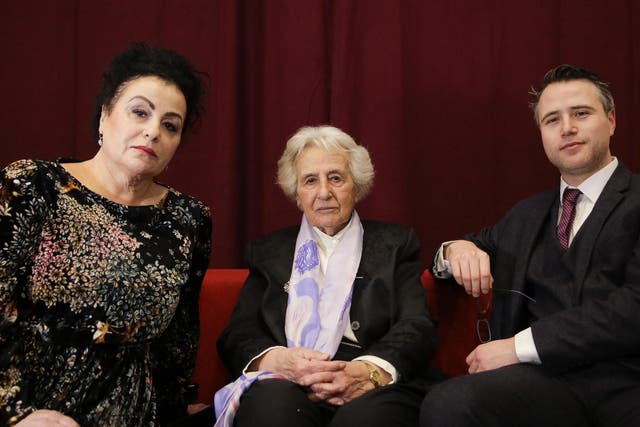 Holocaust survivor Anita Lasker-Wallfisch, centre, her daughter Maya Jacobs Lasker-Wallfisch, left, and her grandson Simon Wallfisch, right, pose for a photo after an interview with the Associated Press in Berlin, Germany, Sunday 27 January 2019.
