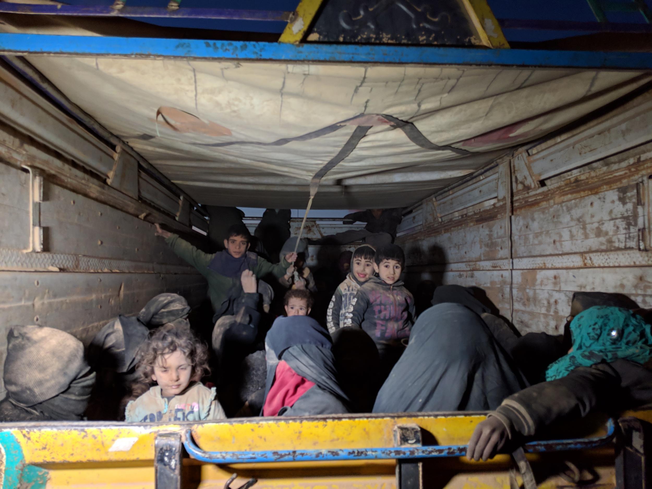 Trucks full of women and children arrive from the last Isis-held areas