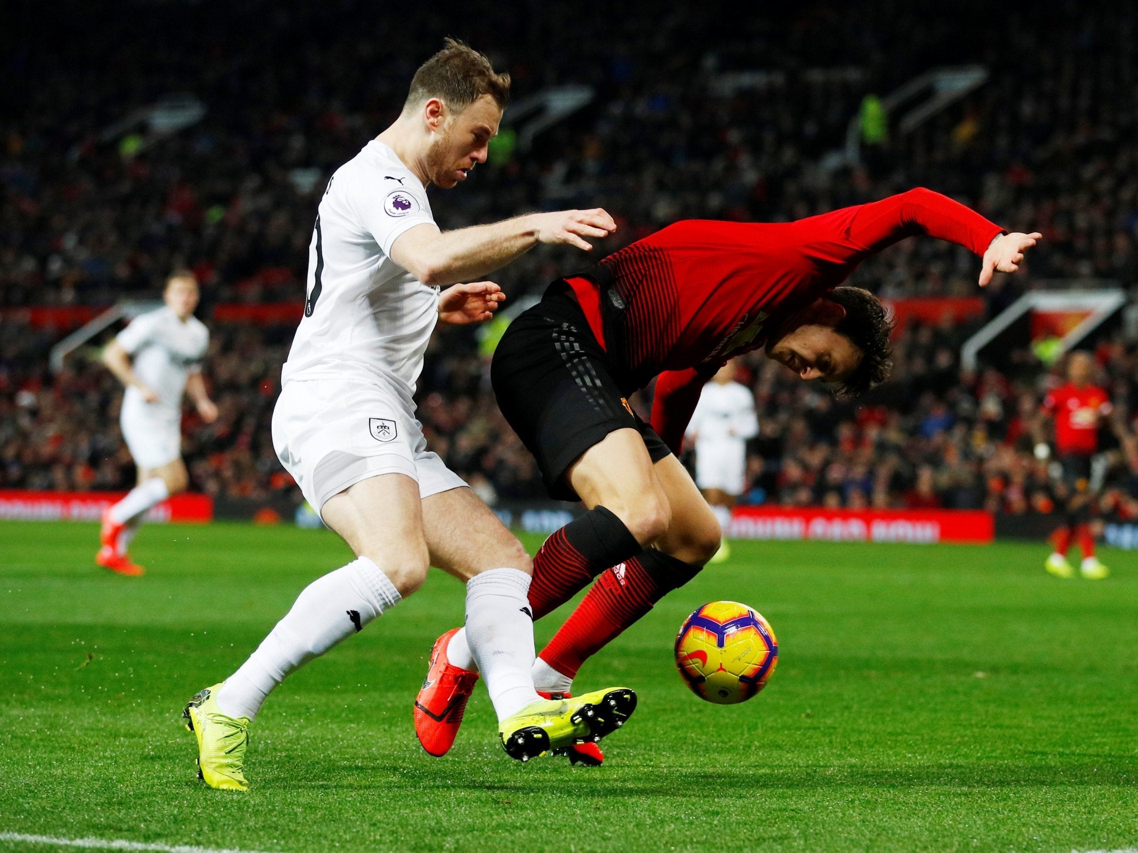 Ashley Barnes challenges Victor Lindelof