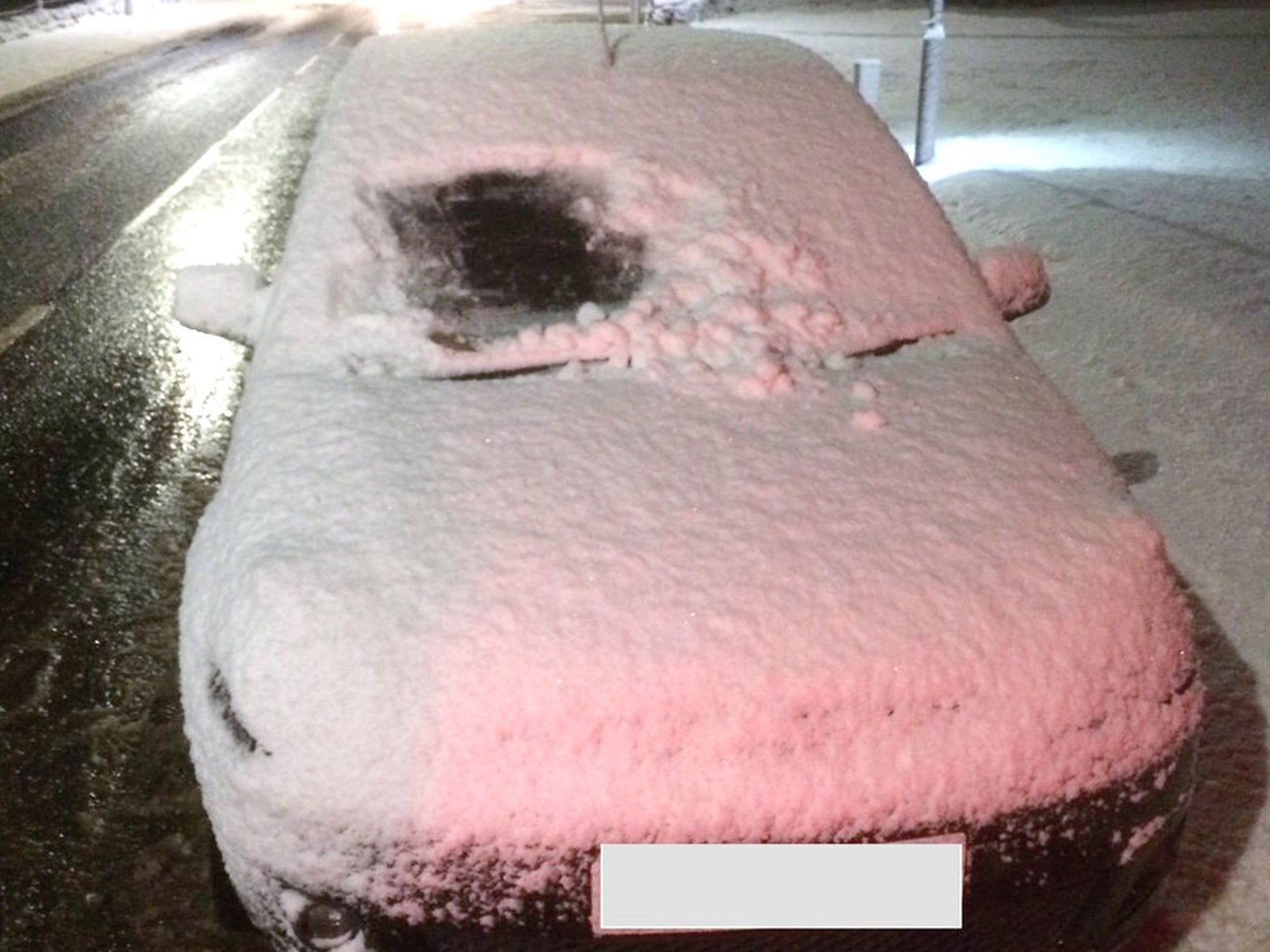 Police Scotland stop car due to its windows still being covered in snow.