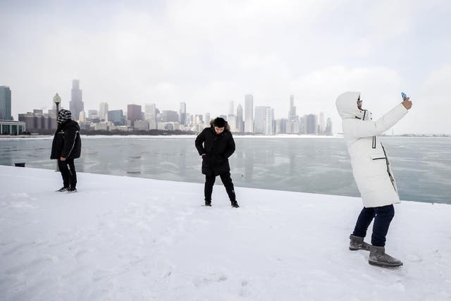 A High School student from China takes a selfie along Lake Michigan in Chicago, Illinois, USA, 29 January 2019