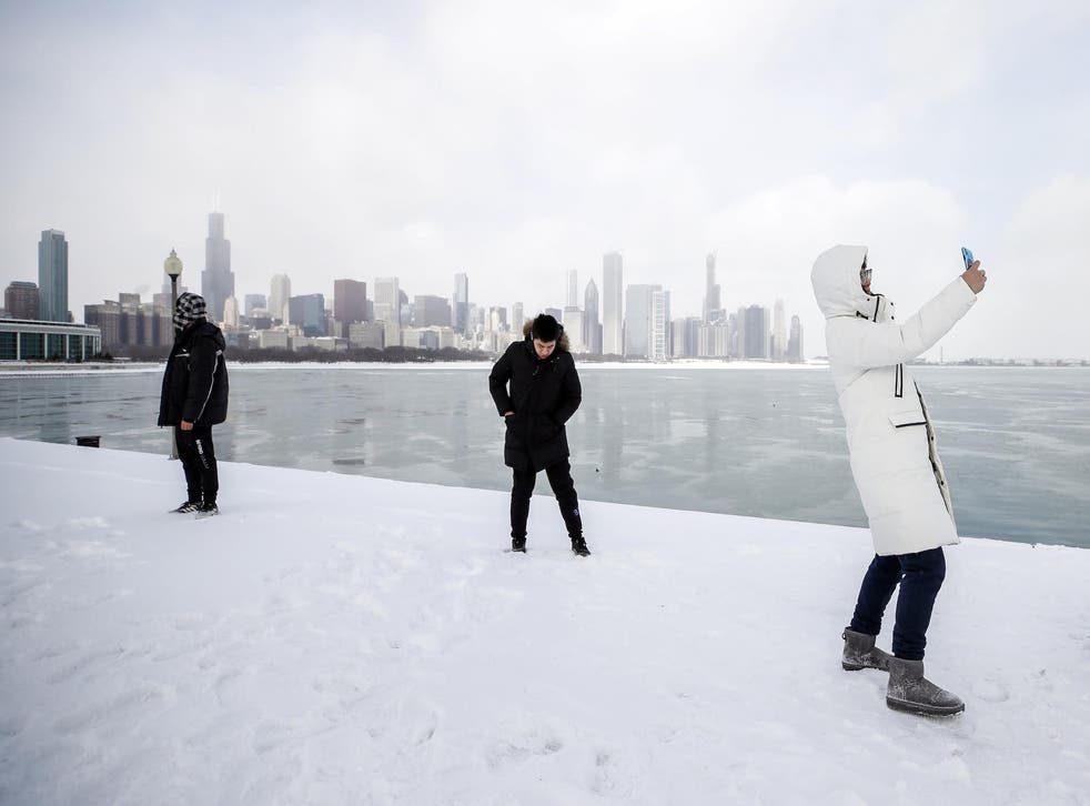 A High School student from China takes a selfie along Lake Michigan in Chicago, Illinois, USA, 29 January 2019
