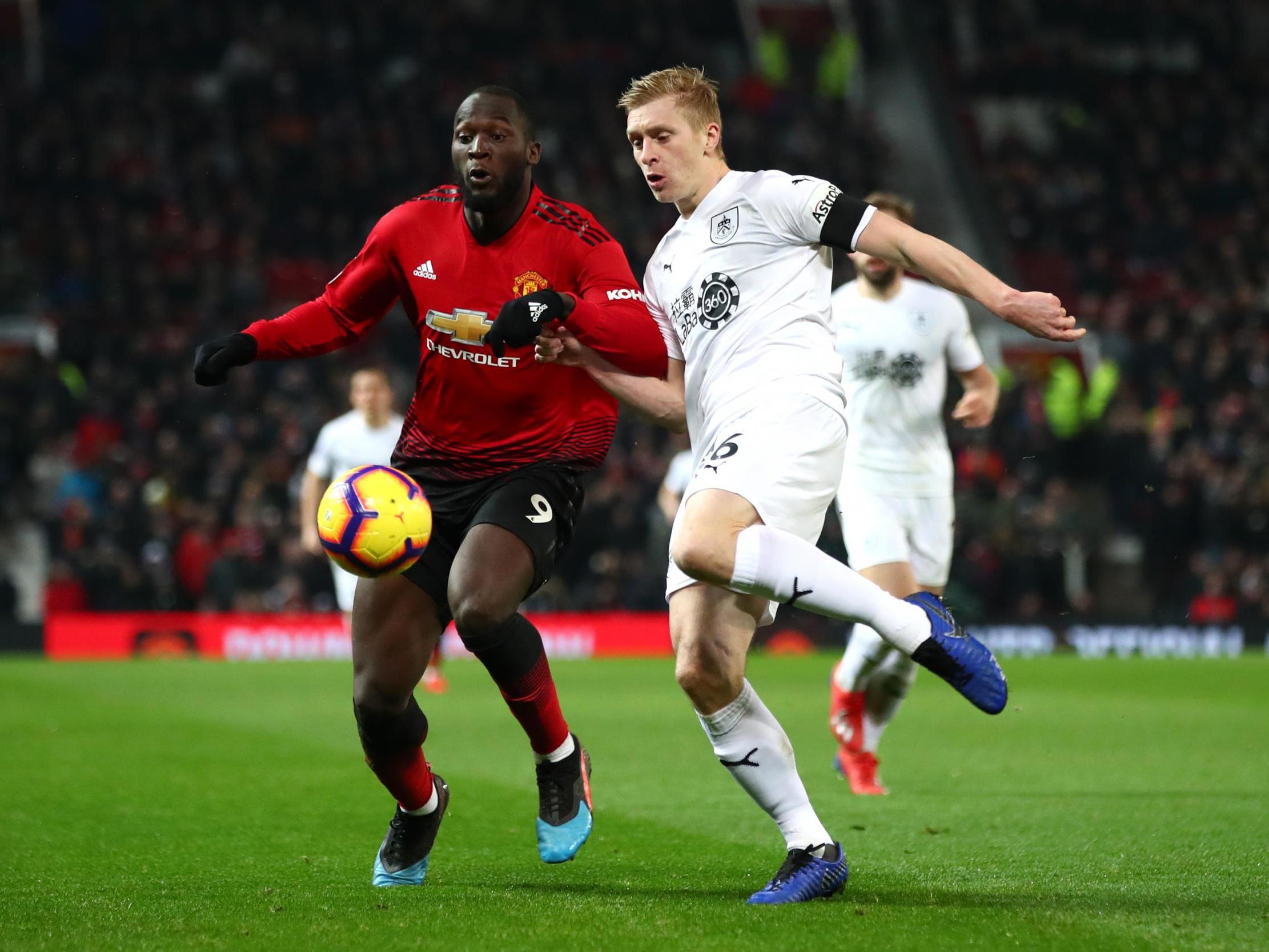 Ben Mee clears the ball as he’s challenged by Romelu Lukaku