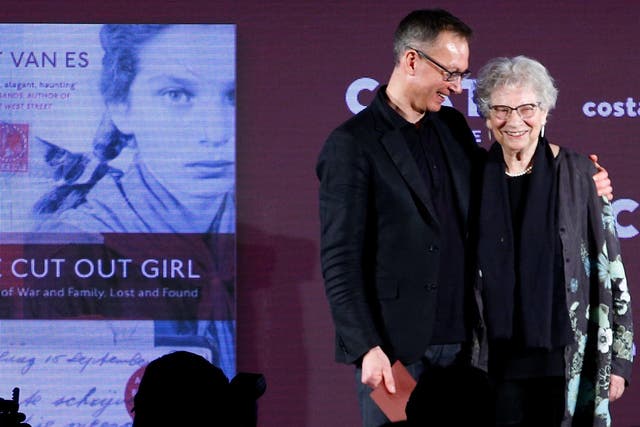Bart van Es, author of the book 'The Cut Out Girl', embraces the subject of his book Lien de Jong during the Costa Book of the Year Award ceremony in London