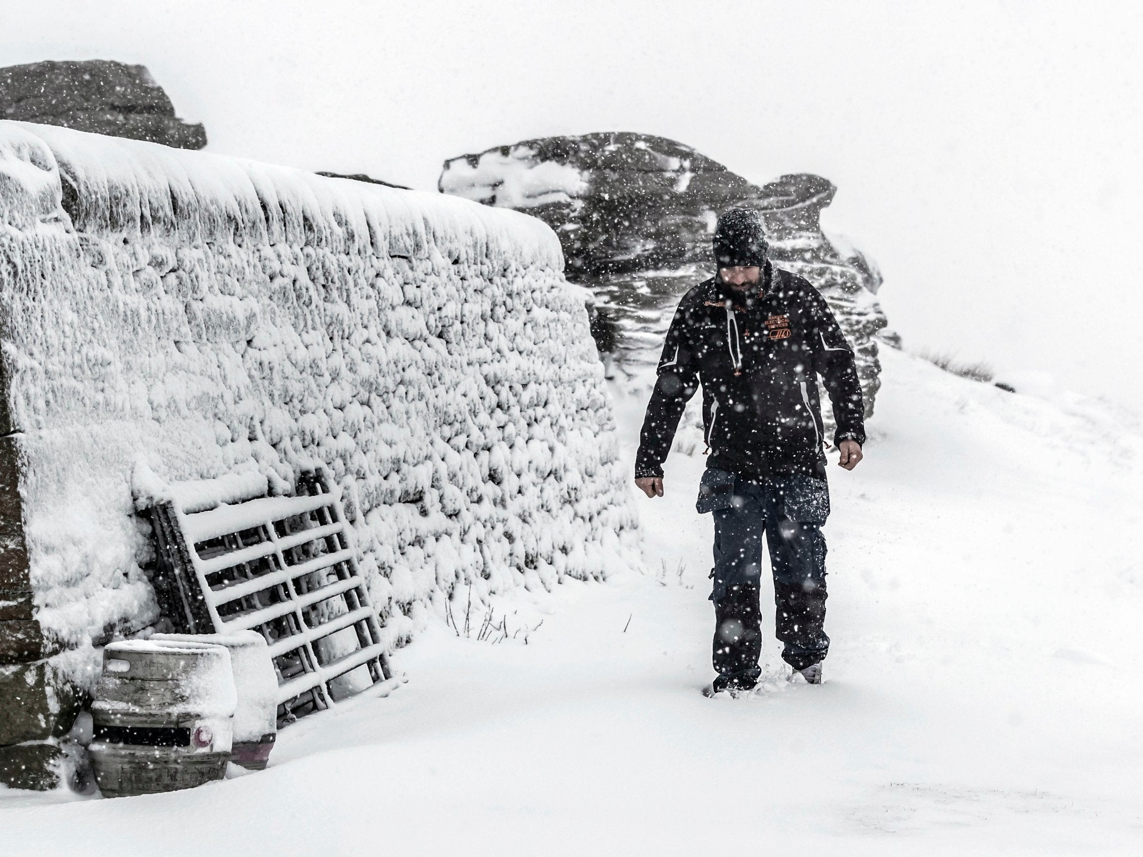 A man walks in snowy conditions at the Tan Hill Inn in North Yorkshire; up to 10cm of snow could fall on higher ground as temperatures drop across large parts of the UK this week