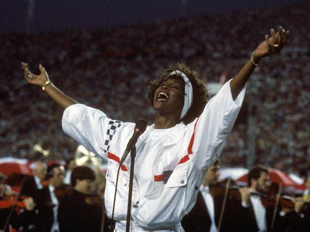 Whitney Houston sings the National Anthem at Super Bowl XXV at Tampa Stadium, Florida, on 27 January 1991