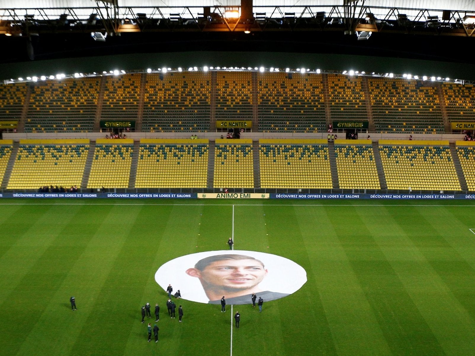 An image of Emiliano Sala is unfurled on the pitch in Nantes