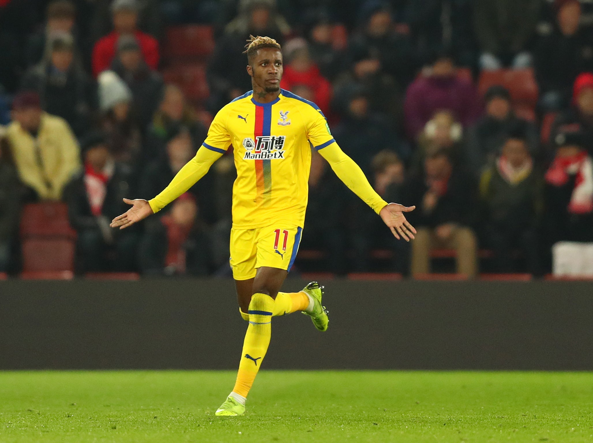 Wilfried Zaha celebrates his goal