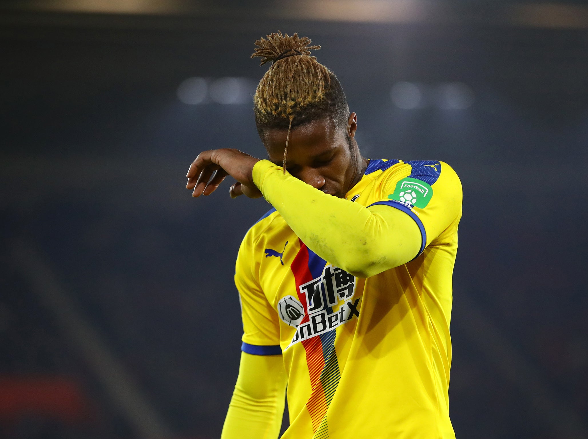 Zaha reacts after getting sent off