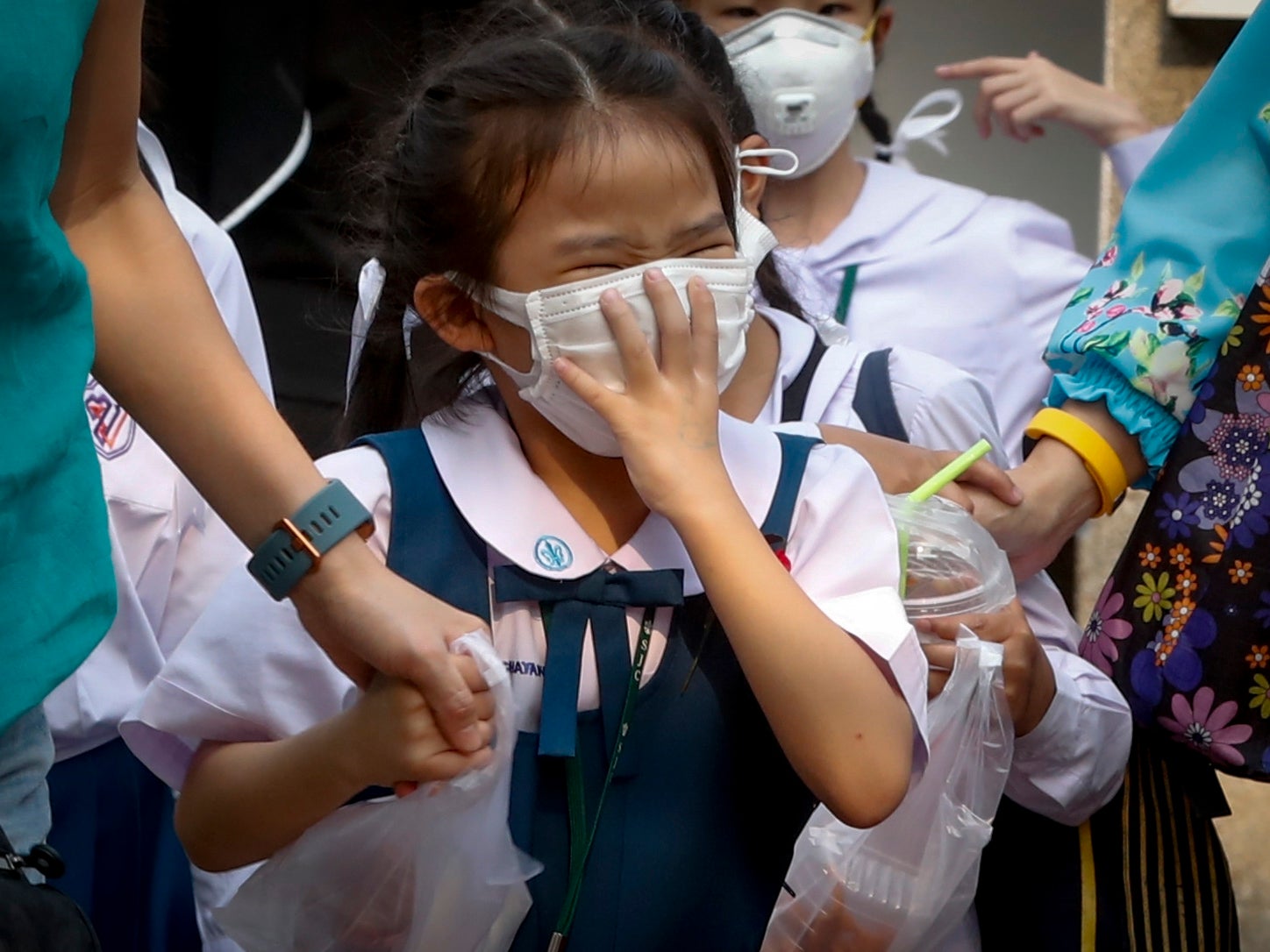 A Thai student wears a face mask as heavy air pollution continues to affect Bangkok