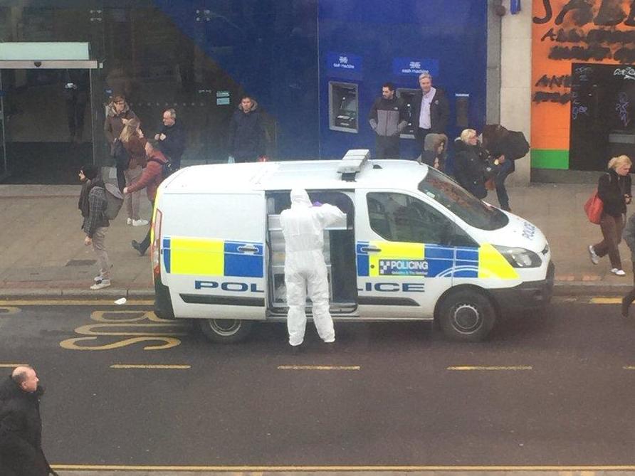 Police forensics workers at the scene of machete attack in Sheffield