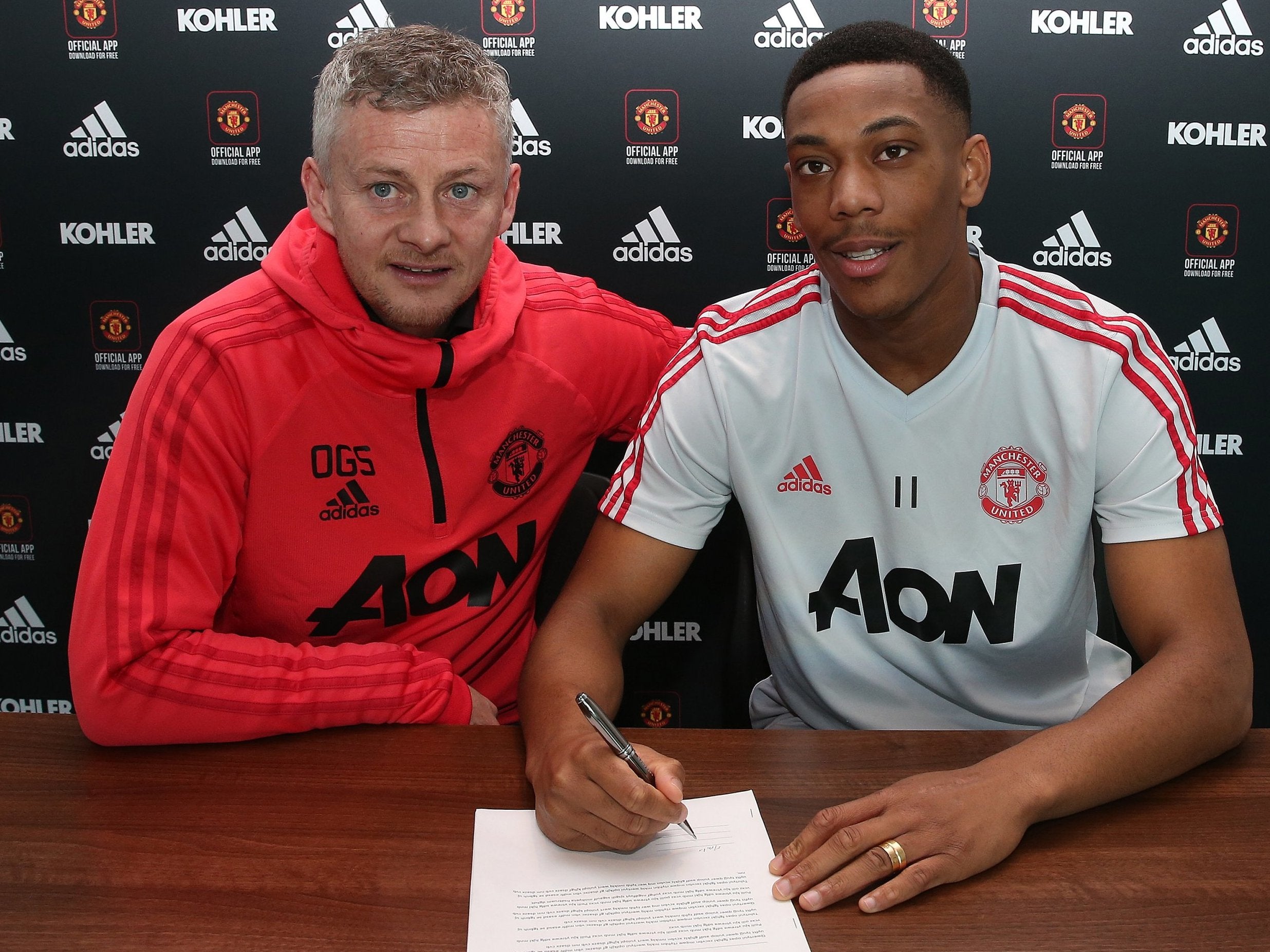 Anthony Martial signs on the dotted line to extend his stay