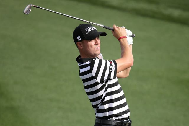 Justin Thomas plays his second shot on the second hole