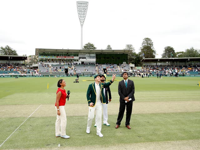 Tim Paine tosses the coin before the Canberra Test match