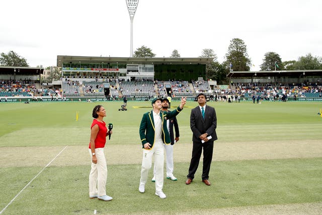 Tim Paine tosses the coin before the Canberra Test match