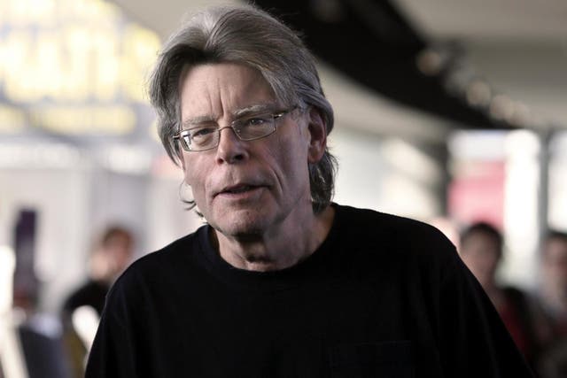 Stephen King poses for photographers on 13 November, 2013 in Paris, before a book signing event dedicated to the release of his new book Doctor Sleep, the sequel to his 1977 novel The Shining.