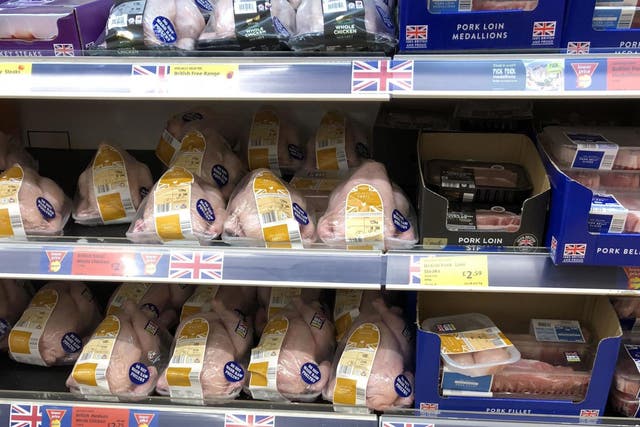 Higher welfare chicken placed on the top shelf in Aldi, with lower-welfare meat at shoppers' eye level