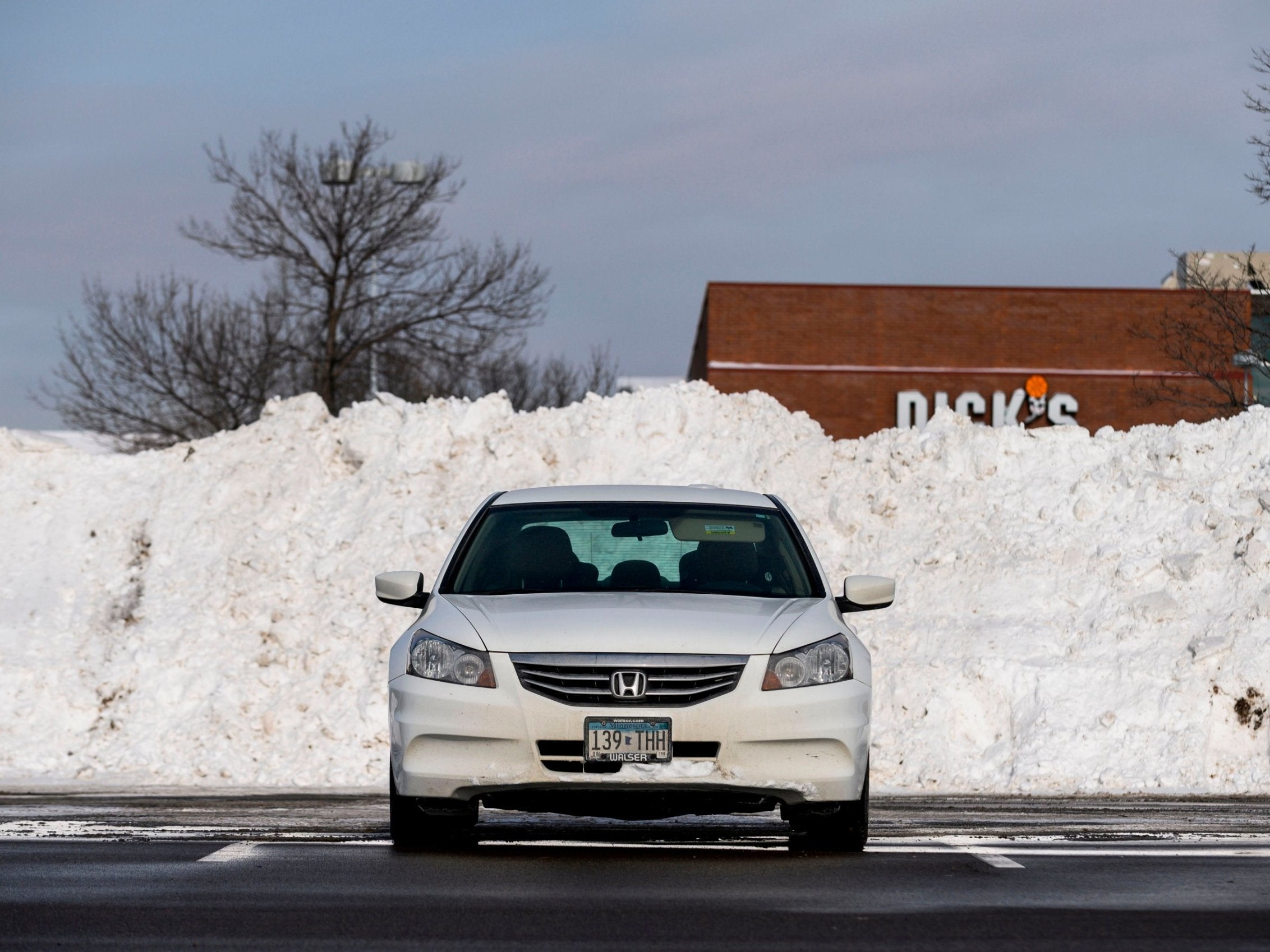 Snow is piled high in the car park of a shopping centre in Minnetonka, Minnesota. (AFP/Getty/Stephen Maturen)