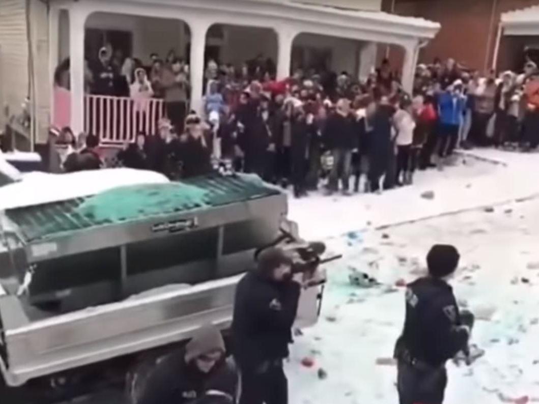 Police armed with compressed air guns fire pepper balls at students in Morgantown, West Virginia