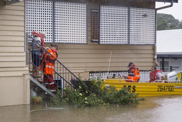 State emergency service volunteers rescue residents in Townsville, Queensland