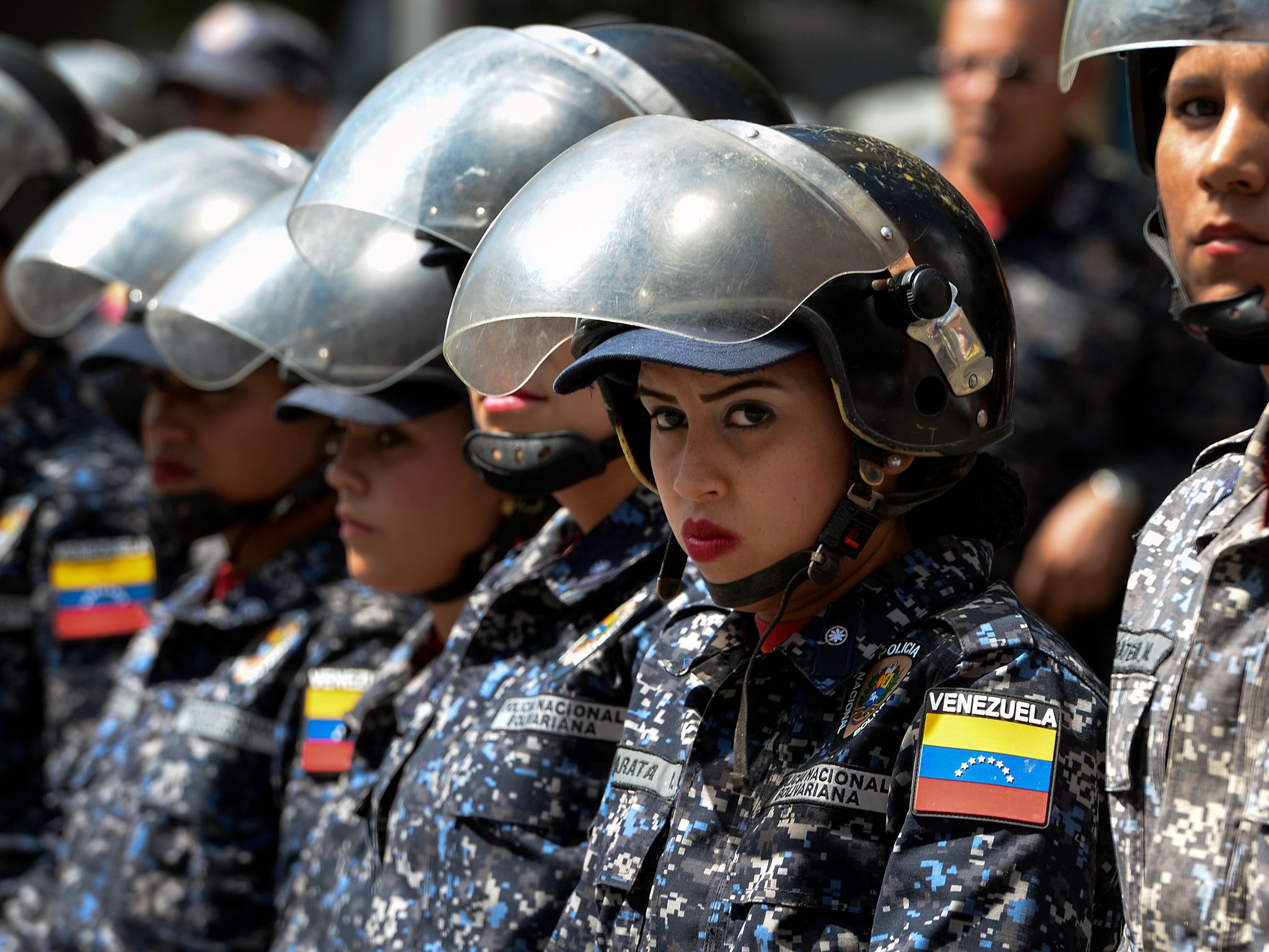 The Bolivarian National Police stand guard near ‘Dr JM de los Rios’ Children’s Hospital in Caracas (AFP/Getty)