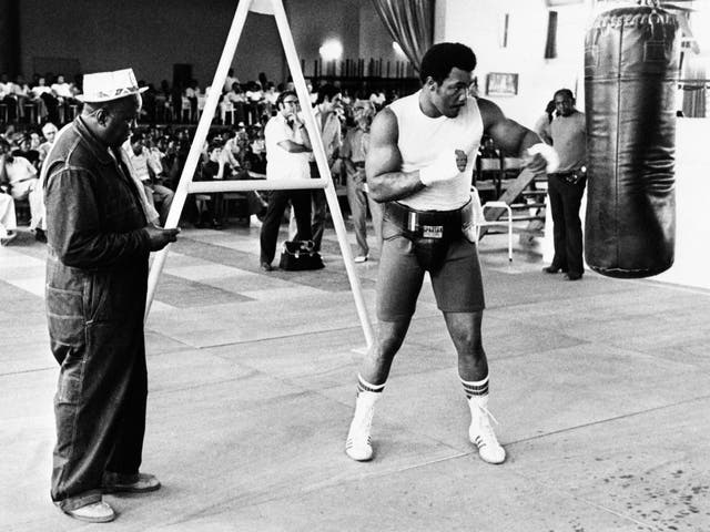<p>George Foreman in training ahead of his life-defining fight against Muhammad Ali in 1974</p>