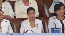 AOC refuses to stand for Trump as she joins women in protest
